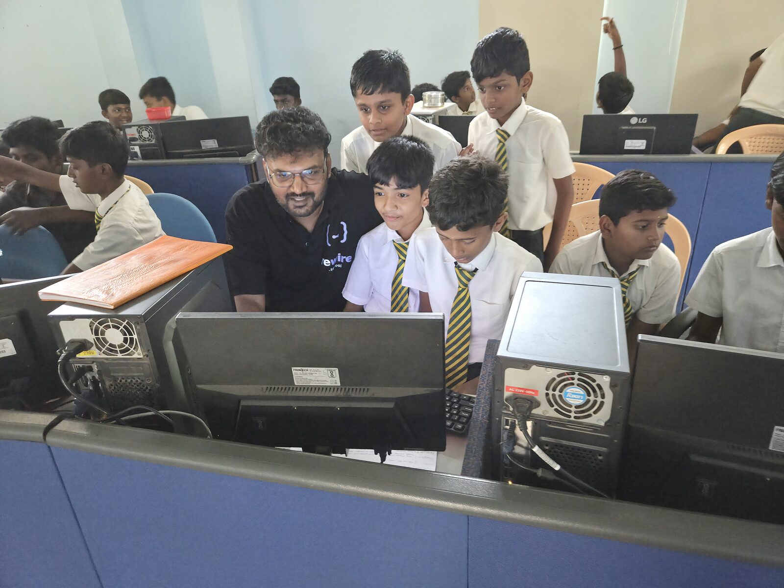 The Rewire founder building an AI app alongside students in a school computer lab