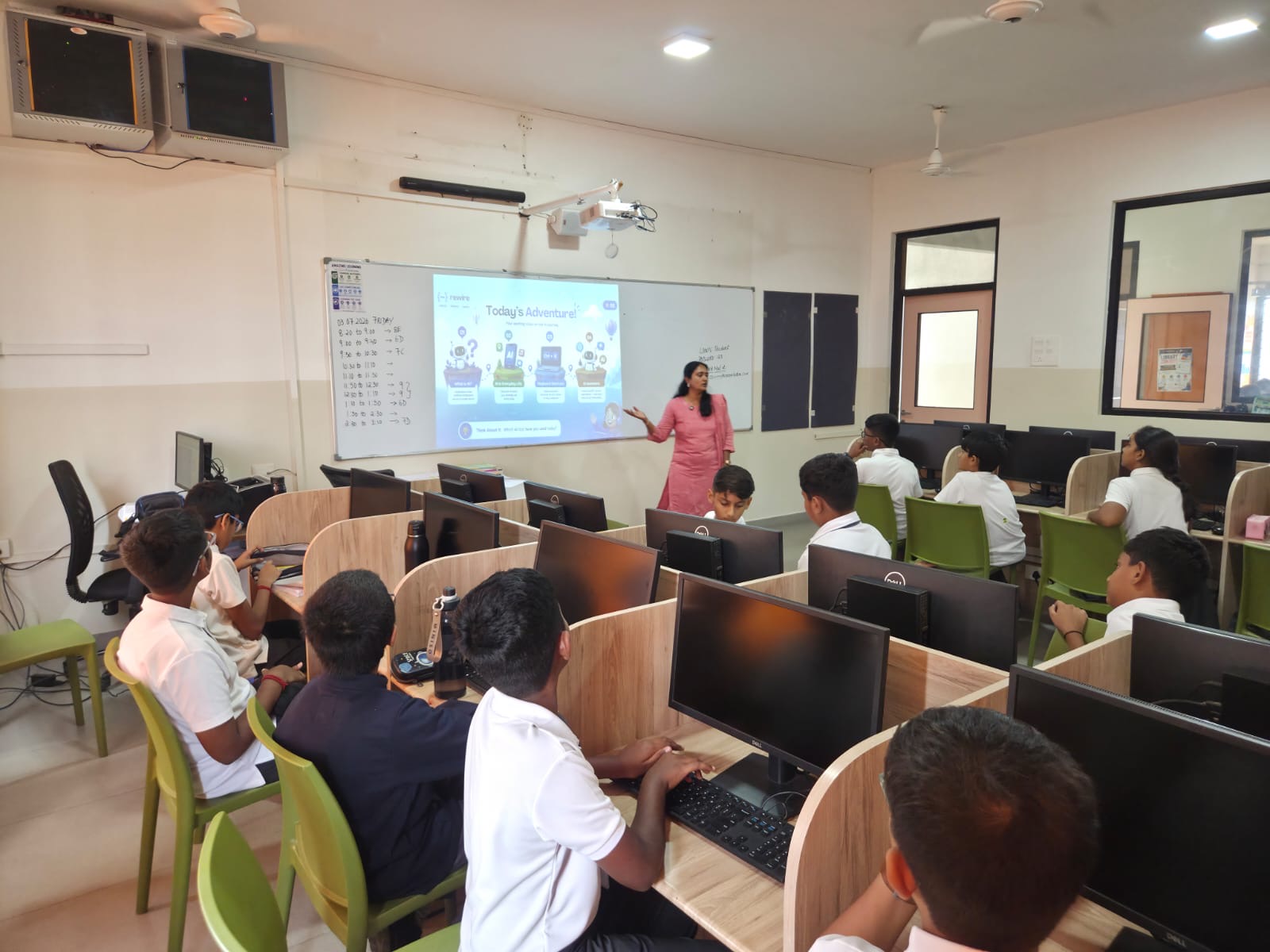 A full computer lab of students during a Rewire AI session