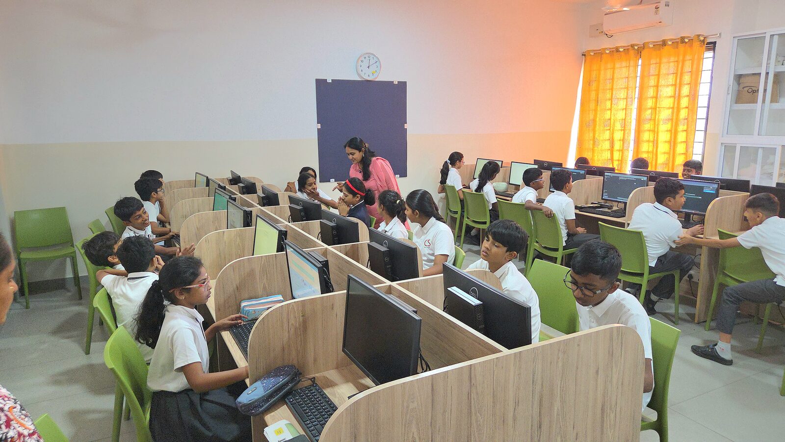 Students working hands-on with a Rewire mentor during an AI session