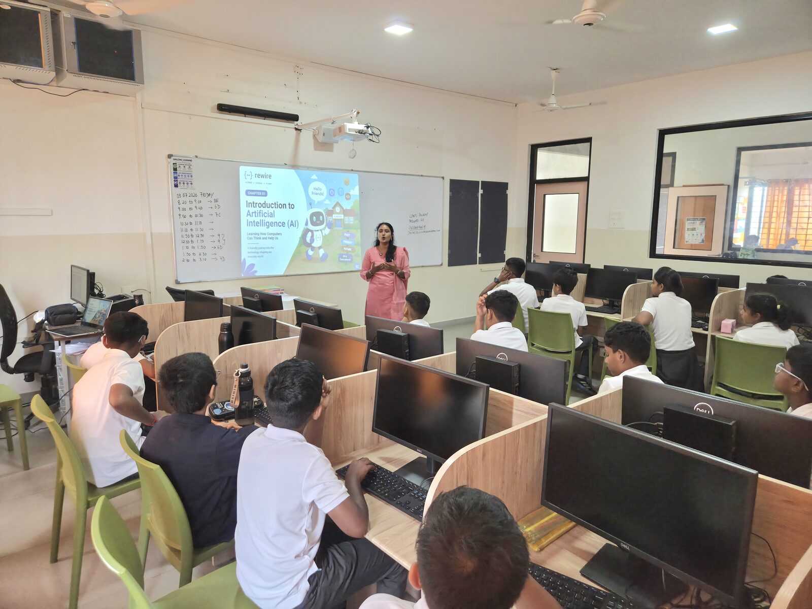 A Rewire instructor introducing Artificial Intelligence to a class of students